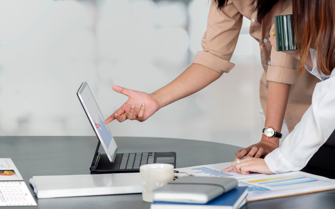 Business owner reviewing financial documents with a valuation expert