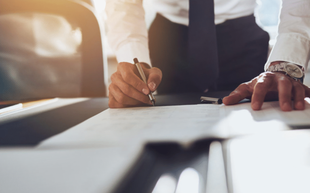 Business owner reviewing internal systems and team performance to improve business value